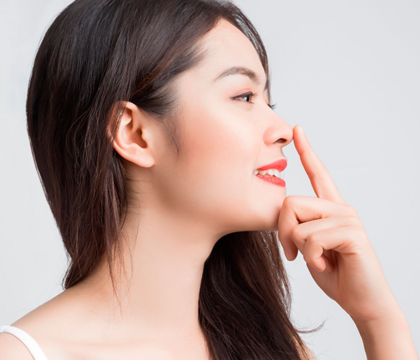 Asian patient after rhinoplasty surgery at Dr. Solomon's clinic in Toronto